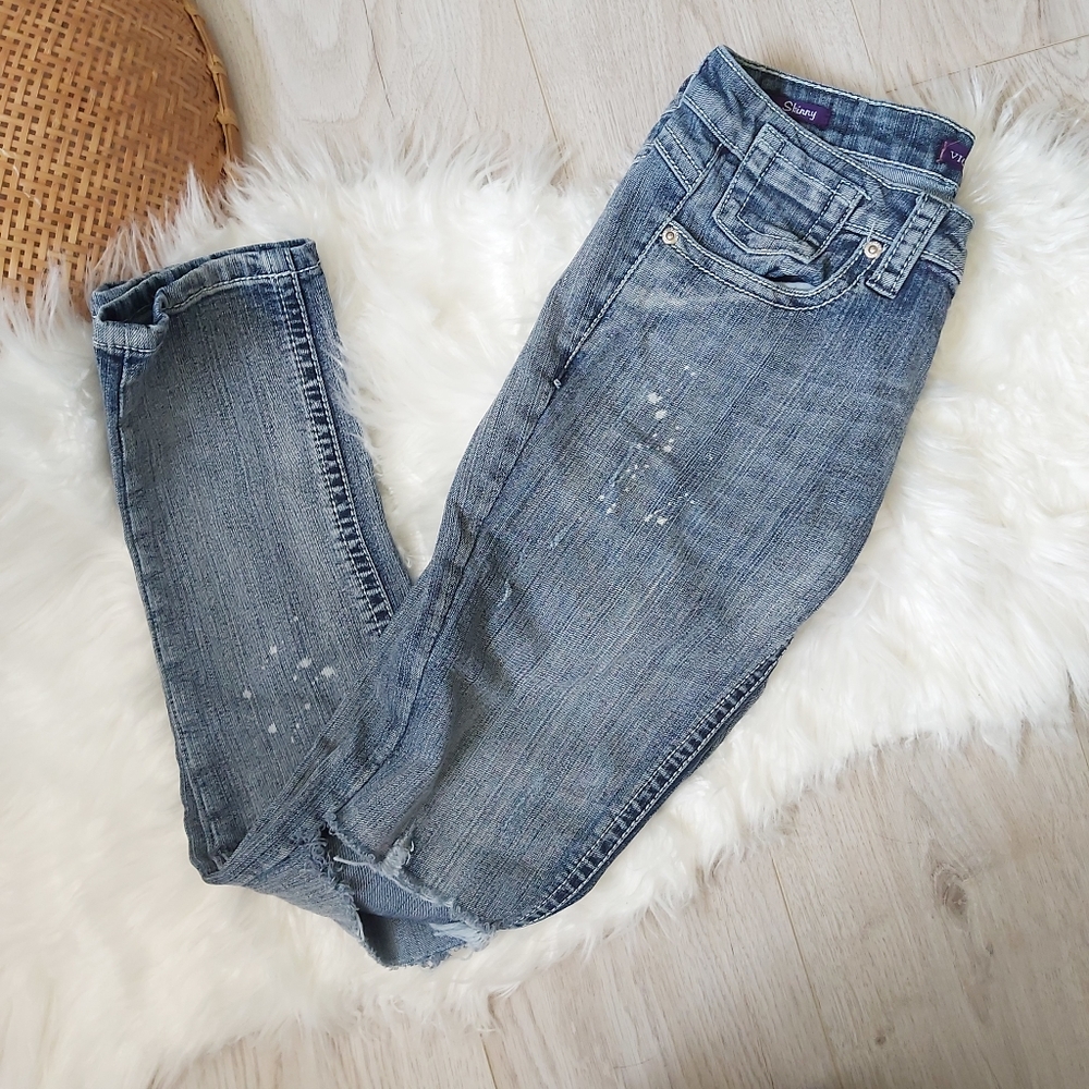 Ankle length distressed skinny jeans